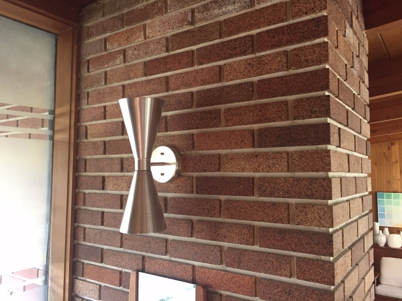 Detail shot showing the brick mass and mid-century scone in the Calgary Trend House